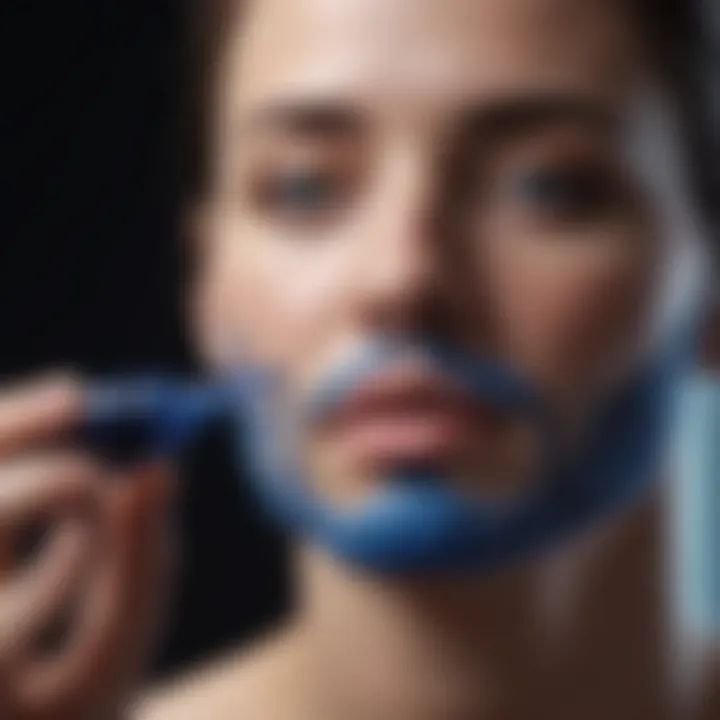 User applying Deep Blue essential oil on skin