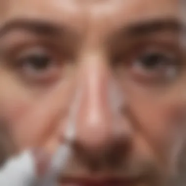 Close-up of a person using a nasal spray correctly.