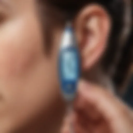 A close-up of an ear thermometer demonstrating its use.